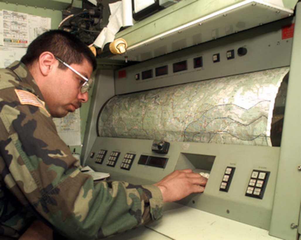 U.S. Army Sgt. Daniel Ledesman works on a AN/TPQ-36 Fire Finder Radar System set up at the International Airport in Sarajevo, Bosnia and Herzegovina, on April 20, 1996. The Fire Finder Radar has the capability to determine where a round was fired from, where it will land and will compute coordinates for a counterattack if needed. The radar can track artillery rounds, mortars, and rounds as small as .50-caliber. Ledesman, from the 161st Target Acquisition Battery, Kansas National Guard, is deployed as part of the NATO Implementation Force (IFOR) in Bosnia and Herzegovina for Operation Joint Endeavor. 