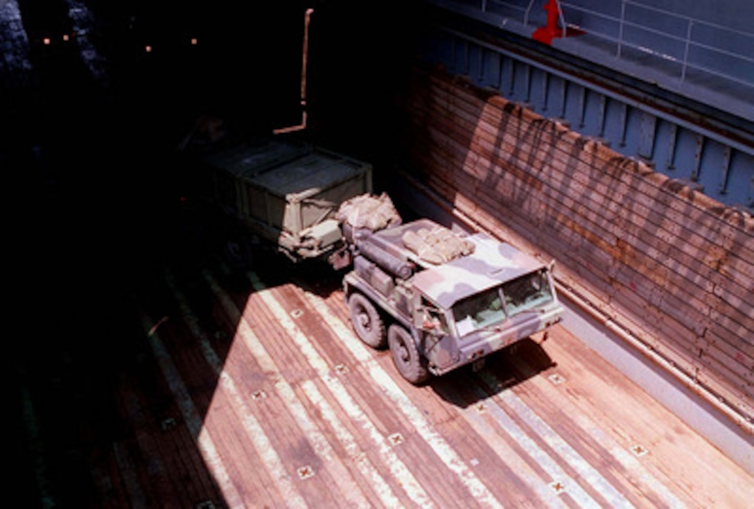 A U.S. Marine Corps Logistic Vehicle System from the Mobile Combat Service Support Detachment, turns around in the well deck of the USS Whidbey Island (LSD 41) at Morehead City, N.C., on May 4, 1996, for Combined Joint Task Exercise 96. More than 53,000 military service members from the United States and the United Kingdom are participating in Combined Joint Task Force Exercise 96 on military installations in the Southeastern United States and in waters along the Eastern seaboard. The Logistic Vehicle System transports supplies, ammunition, heavy equipment and armored vehicles. 
