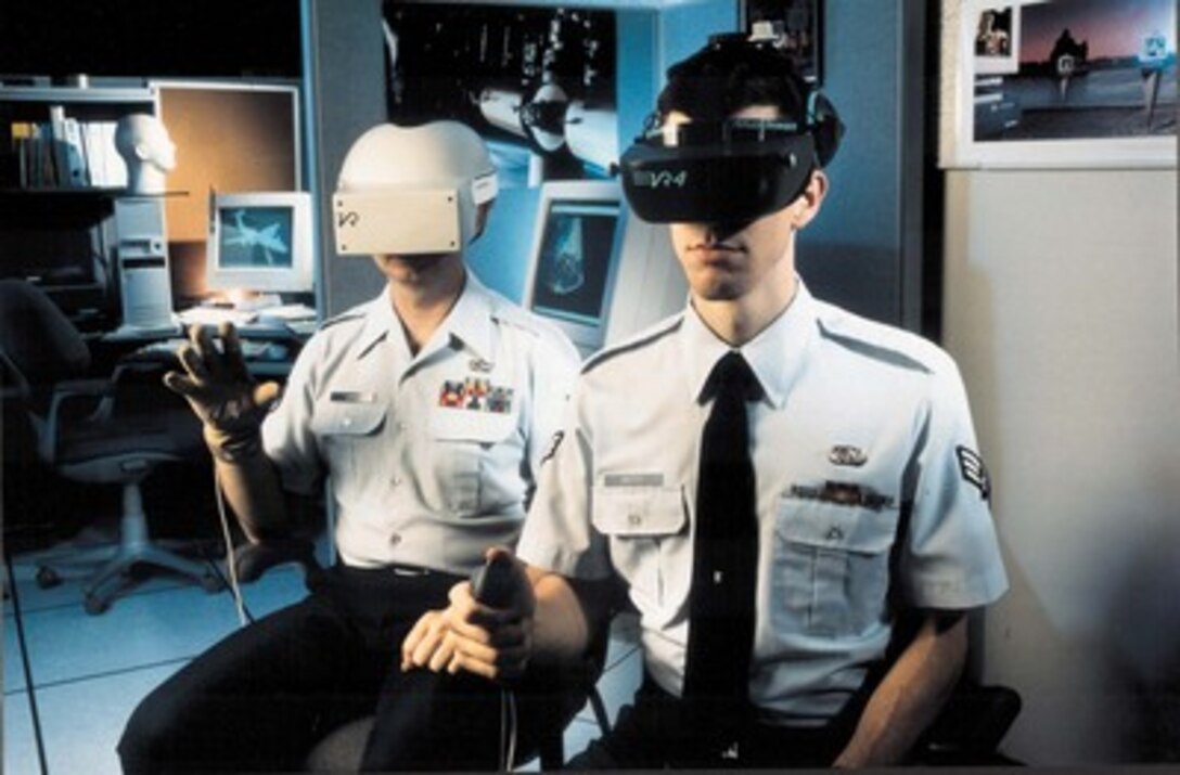 Third Place Illustrative'VR4' by Master Sgt. Fernando Serna, U.S. Air Force.Tech. Sgt. William Lexa (left) and Senior Airman Raymond Pettit conduct virtual reality research at Brooks Air Force Base, Texas, on pilot/cockpit systems to help make their training more realistic.