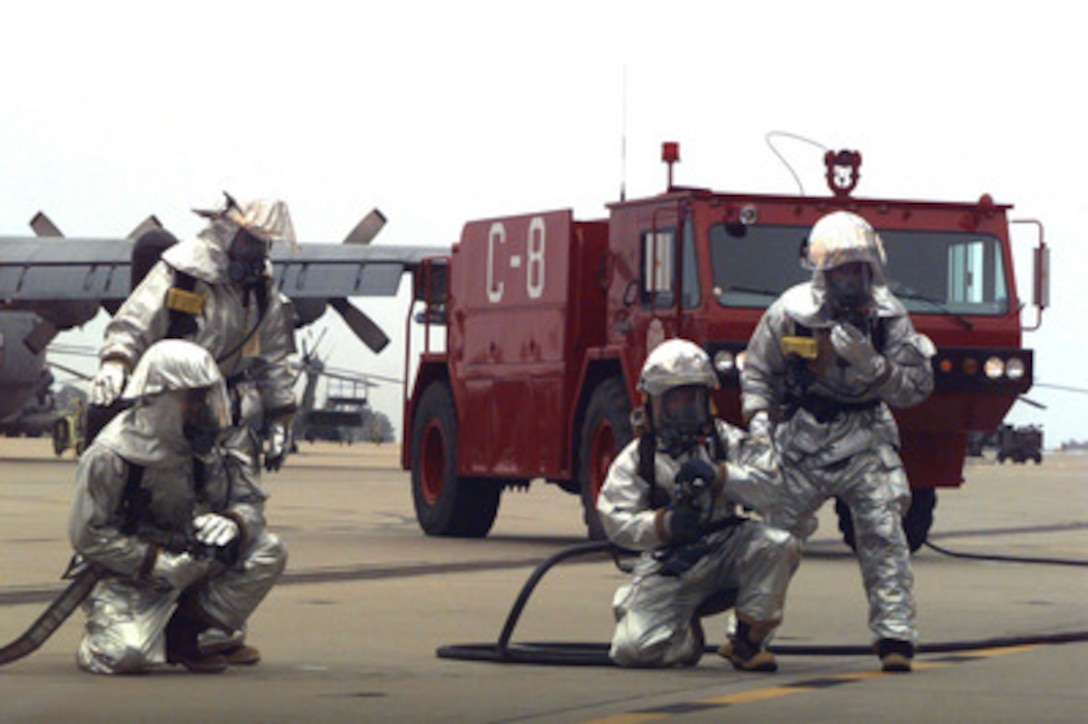 U.S. Air Force firefighters from the 16th Civil Engineer Squadron, Hurlburt Field, Fla., respond to a mock AC-130 Spectre Gunship egress exercise during the base's Operational Readiness Inspection on April 19, 1996. The 16th Special Operations Wing Operational Readiness Inspection occurs in conjunction with the Combined Joint Training Field Exercise '96. 