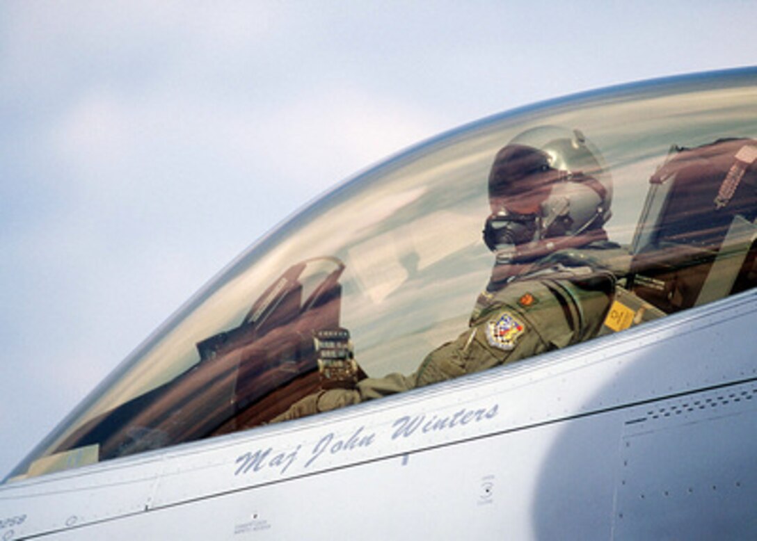 Maj. John Winters waits to open his cockpit after arriving at Tyndall Air Force Base, Fla., on Oct. 22, 1996, for William Tell '96. William Tell is an annual competition designed to challenge the air-to-air capabilities of combat air forces and have their crews perform under simulated combat conditions. Winters and his F-16 Fighting Falcon are from the 419th Fighter Wing, Hill Air Force Base, Utah. 