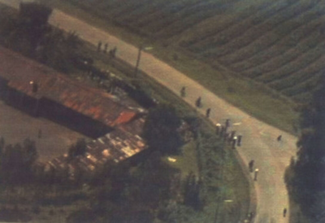 U.S. Navy aerial photograph of refugees on a road in the vicinity of Goma, Zaire, taken on Nov. 20, 1996. 