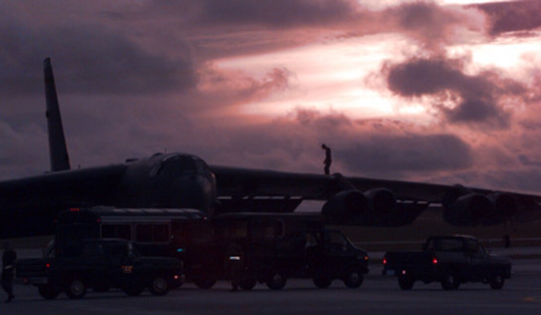 A member of the 96th Bomber Maintenance Squadron walks the wing of a U.S. Air Force B-52 Stratofortress bomber as the squadron performs post-mission maintenance at Andersen Air Force Base, Guam, on Sept. 4, 1996, after the aircraft's return from launching cruise missiles into Iraq. Two Stratofortress bombers delivered a payload of Conventional Air Launched Cruise Missiles against selected air defense targets south of the 33rd parallel in Iraq. The attacks are designed to reduce risks to the pilots who will enforce the expanded no-fly zone. President Clinton announced an expanded no-fly zone in response to an Iraqi attack against a Kurdish faction. The larger no-fly zone in Southern Iraq will make it easier for U.S. and coalition partners to contain Saddam Hussein's aggression. The B-52's are deployed to Guam from the 2nd Bomber Wing, Barksdale Air Force Base, La. 