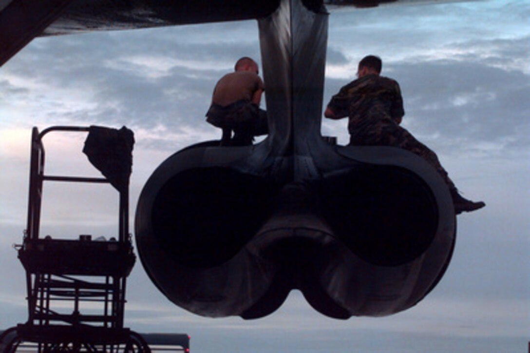 Members of the 96th Bomber Maintenance Squadron perform post-mission maintenance on a U.S. Air Force B-52 Stratofortress bomber at Andersen Air Force Base, Guam, on Sept. 4, 1996, after the aircraft's return from launching cruise missiles into Iraq. Two Stratofortress bombers delivered a payload of Conventional Air Launched Cruise Missiles against selected air defense targets south of the 33rd parallel in Iraq. The attacks are designed to reduce risks to the pilots who will enforce the expanded no-fly zone. President Clinton announced an expanded no-fly zone in response to an Iraqi attack against a Kurdish faction. The larger no-fly zone in Southern Iraq will make it easier for U.S. and coalition partners to contain Saddam Hussein's aggression. The B-52's are deployed to Guam from the 2nd Bomber Wing, Barksdale Air Force Base, La. 