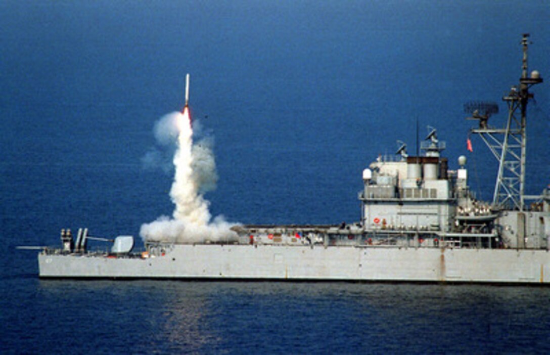 A Tomahawk cruise missile launches from the stern vertical launch system of the USS Shiloh (CG 67) to attack selected air defense targets south of the 33rd parallel in Iraq on Sept. 3, 1996, as part of Operation Desert Strike. The attacks are designed to reduce risks to the pilots who will enforce the expanded no-fly zone. President Clinton announced an expanded no-fly zone in response to an Iraqi attack against a Kurdish faction. The larger no-fly zone in Southern Iraq will make it easier for U.S. and coalition partners to contain Saddam Hussein's aggression. The U.S. Navy Ticonderoga Class cruiser launched the missiles as it operated in the Persian Gulf. DoD photo