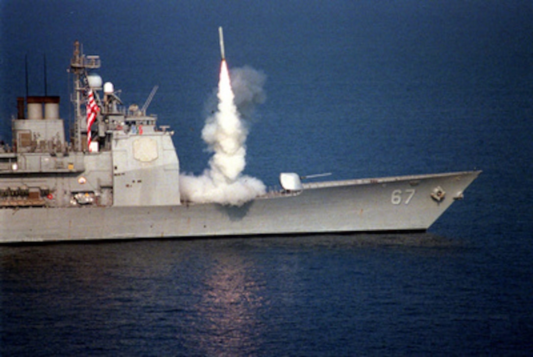 A Tomahawk cruise missile launches from the forward vertical launch system of the USS Shiloh (CG 67) to attack selected air defense targets south of the 33rd parallel in Iraq on Sept. 3, 1996, as part of Operation Desert Strike. The attacks are designed to reduce risks to the pilots who will enforce the expanded no-fly zone. President Clinton announced an expanded no-fly zone in response to an Iraqi attack against a Kurdish faction. The larger no-fly zone in Southern Iraq will make it easier for U.S. and coalition partners to contain Saddam Hussein's aggression. The U.S. Navy Ticonderoga Class cruiser launched the missiles as it operated in the Persian Gulf. 
