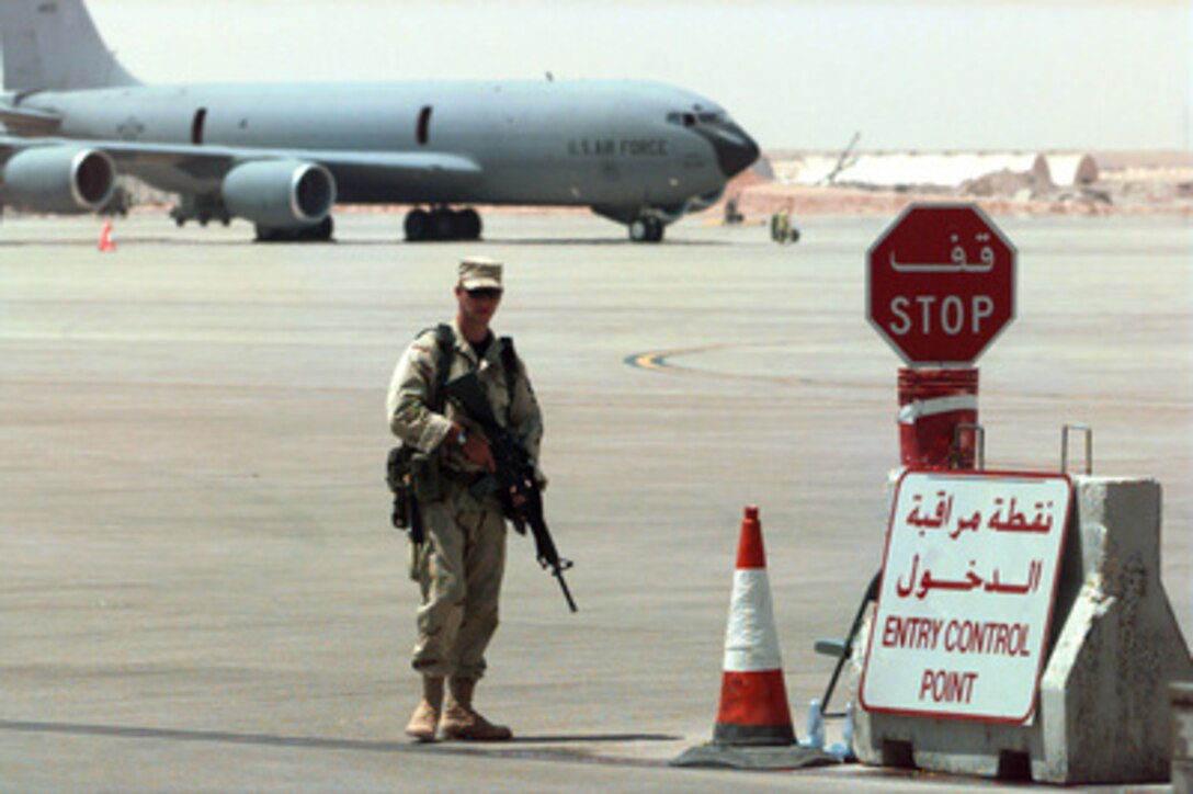 Security Policeman Airman 1st Class Chris Culross stands guard at the Flightline Entry Control Point at Prince Sultan Air Base, Al Kharj, Saudi Arabia, on Sept. 4, 1996. The security police contingent at Al Kharj has established a single entry point for all vehicles as security measure which allows for tighter control of vehicle movement on and off the flightline. Personnel, aircraft, and equipment conducting Operation Southern Watch are being moved from bases in Dhahran and Riyadh to the remote desert air base to reduce their vulnerability to terrorist attack. Southern Watch is the U.S. and coalition enforcement of the no-fly-zone over Southern Iraq. Culcross is deployed to Saudi Arabia from the 320th Security Police Squadron, F.E. Warren Air Force Base, Wyo. 