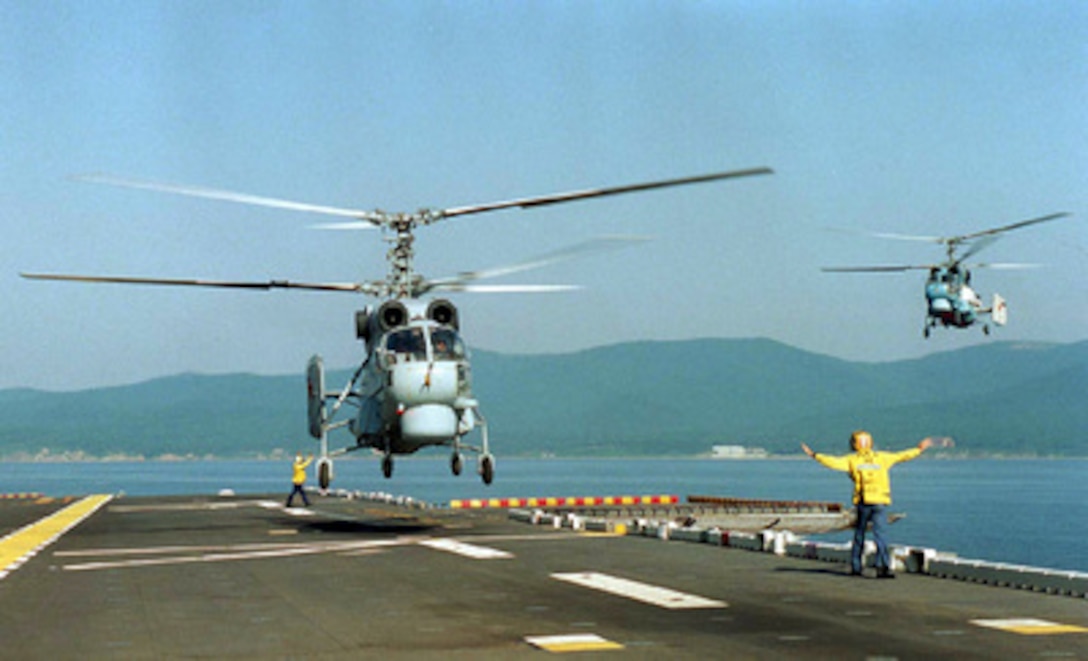 Two Russian KA-27 Helix helicopters prepare to land on the flight deck of the USS Belleau Wood (LHA 3) on Aug. 17, 1996, during Exercise Cooperation From the Sea ''96, off the coast of Vladivostok, Russia. U.S. Navy and Marine Corps units of the 7th Fleet and Russian Federation Navy units are conducting the exercise near the port city of Vladivostok, Russia. The purpose of exercise is to improve interoperability with Russian military forces in conducting disaster relief and humanitarian missions. Personnel exchanges and training will promote cooperation and understanding between the U.S. and Russian Federation Naval Forces. The landing marks the first time Russian helicopters have landed aboard a U.S. Navy ship as part of this annual exercise. 