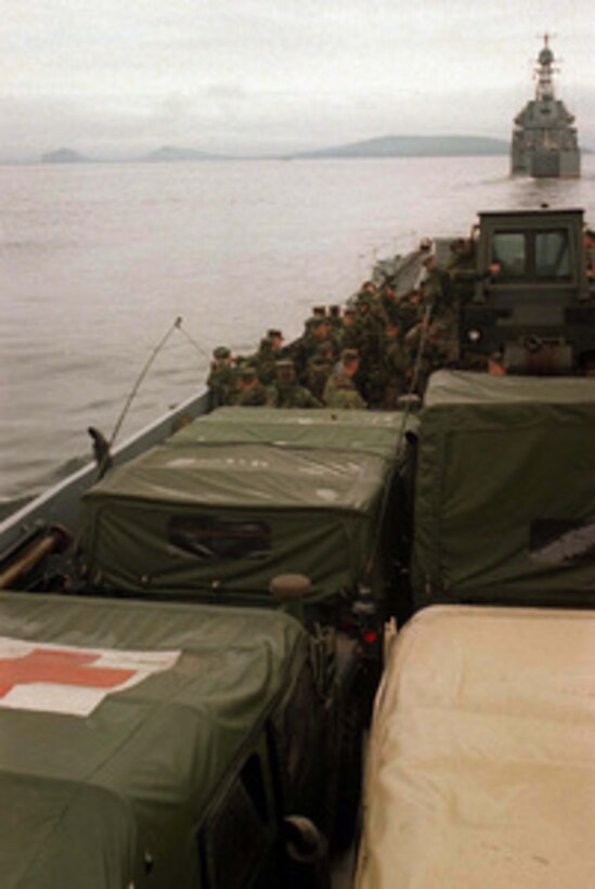 A U.S. Navy landing craft loaded with medical vehicles and supplies for a simulated disaster-relief exercise follows a Russian Ropuchhka II amphibious assault ship on Aug. 14, 1996, during Exercise Cooperation From the Sea '96, near Vladivostok, Russia. U.S. Navy and Marine Corps units of the 7th Fleet and Russian Federation Navy units are conducting the exercise near the port city of Vladivostok. The purpose of the exercise is to improve interoperability with Russian military forces in conducting disaster relief and humanitarian missions. Personnel exchanges and training will promote cooperation and understanding between the U.S. and Russian Federation Naval Forces. 
