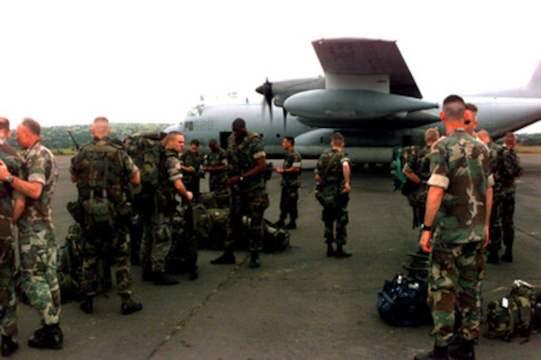 U.S. Marines of the 26th Marine Expeditionary Unit (Special Operations Capable) prepare to move out after arriving in Brazzaville, Republic of the Congo, on April 3, 1997. Command and support elements for a forward joint task force and other enabling elements are deploying to locations in several West African countries as part of contingency planning for a possible future evacuation from Zaire. The deployment is an enhancement to planning for contingency measures to ensure the security of U.S. citizens in Zaire if an evacuation should become necessary. The expeditionary unit is assigned to the USS Nassau (LHA 4). 