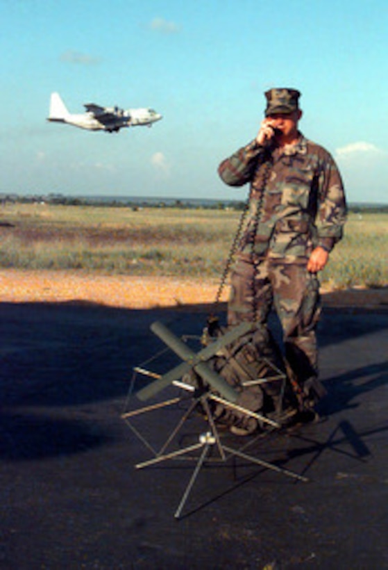 Cpl. Joseph Calebro, U.S. Marine Corps, uses an AN/PSC-3 Satellite Communications Radio to establish communications from the tarmac at Pointe Noire, Republic of Congo, on April 9, 1997. Command and support elements for a forward joint task force and other enabling elements are deploying to locations in several West African countries as part of contingency planning for a possible future evacuation from Zaire. The deployment is an enhancement to planning for contingency measures to ensure the security of U.S. citizens in Zaire if an evacuation should become necessary. Calebro is attached to Aerial Refueler Transport Squadron 252 to provide KC-130 Hercules aircraft with secure communications. 