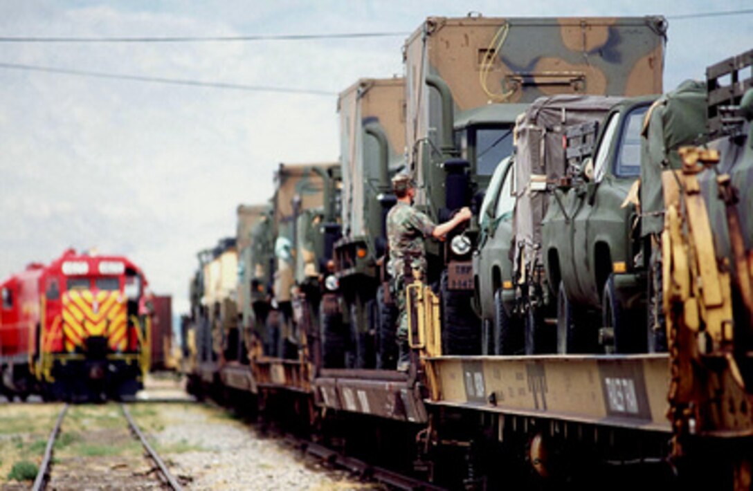 U.S. Army vehicles from the 147th Aviation Battalion arrive by train at Biggs Army Airfield, El Paso, Texas, on April 17, 1997, for Exercise Roving Sands 97. More than 20,000 service members from all branches of the armed forces of the U.S., Canada, Germany, and the Netherlands are participating in Exercise Roving Sands 97. The exercise is designed to refine their skills in operations using an integrated air defense network of ground, missile and radar early warning systems combined with tactical fighter and bomber aircraft operating in a simulated high-threat environment. The 147th will provide UH-60 Black Hawk helicopter support during the exercise. 