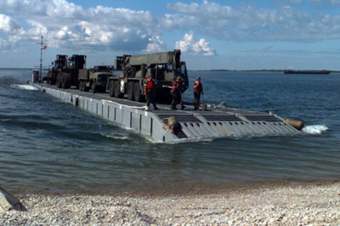 A lighter craft approaches the beach near Paldiski, Estonia, bringing equipment from the S.S. Sgt. Matej Kocak during Exercise Baltic Challenge 97, on July 14, 1997. Baltic Challenge '97 is a multinational exercise conducted as a NATO Partnership for Peace initiative involving more than 2,600 military personnel from Denmark, Estonia, Finland, Latvia, Lithuania, Norway, Sweden, and the U.S. The focus of the training is peacekeeping tasks and humanitarian assistance operations. The lighter craft are being used to move equipment off-loaded from the Maritime Prepositioning Ships anchored off shore to the exercise area on the beach. Beachmaster Unit 2 is homeported in Little Creek, Va. 