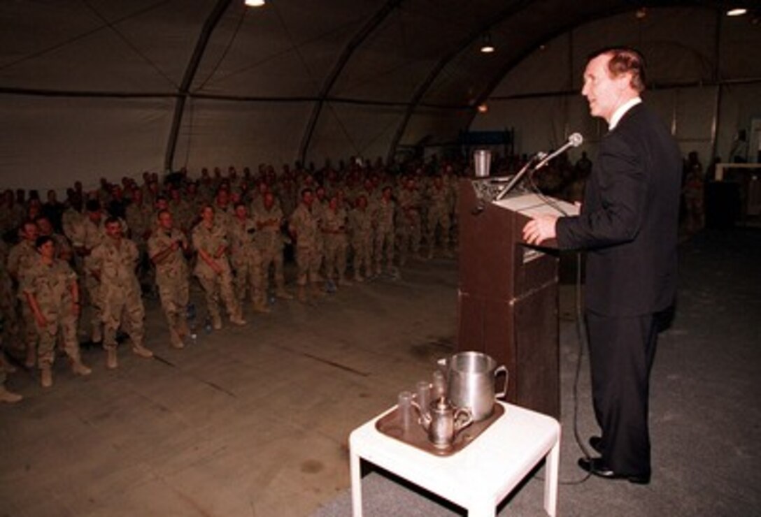 Secretary of Defense William S. Cohen speaks to U.S. personnel at Prince Sultan Air Base, Kingdom of Saudi Arabia, on June 15, 1997. Secretary Cohen also toured the base and lunched with the troops. 