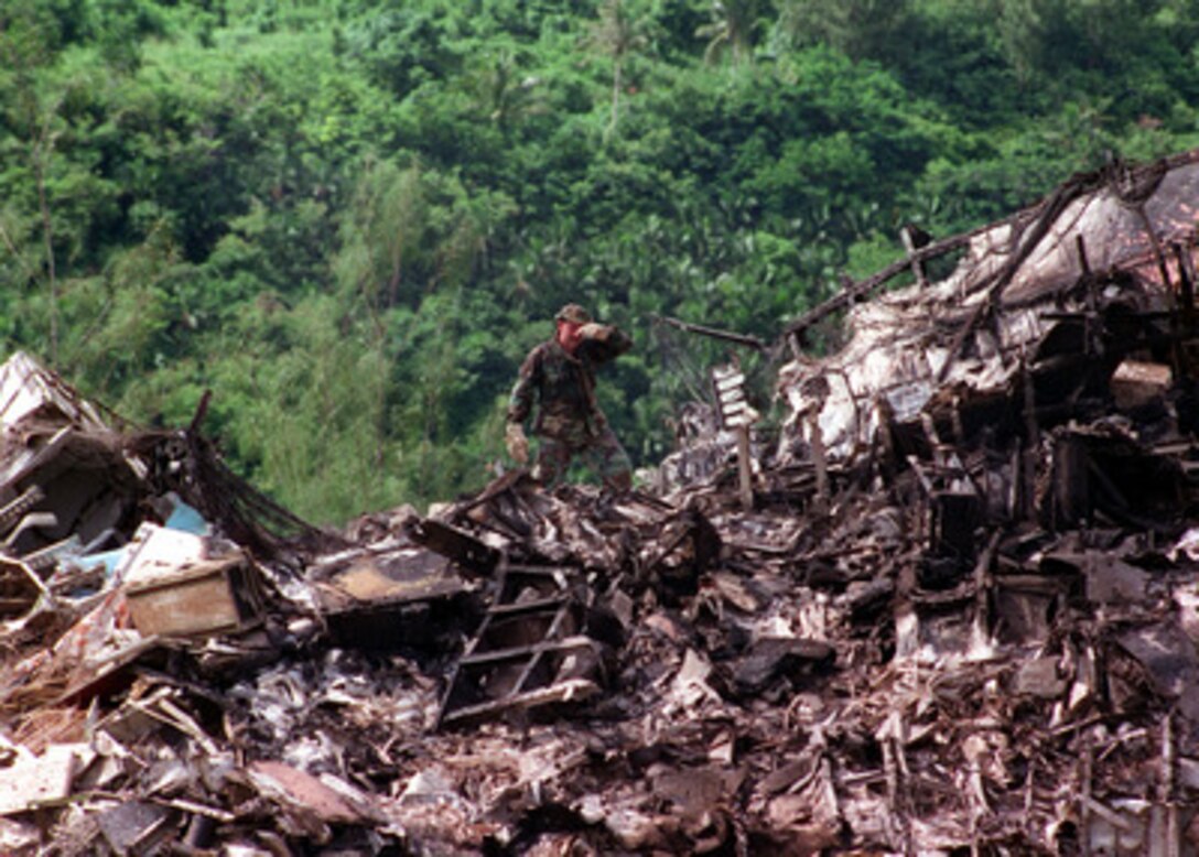 U.S. Navy, Air Force, Coast Guard, local civilian disaster teams and National Transportation Safety Board (NTSB) officials continue crash and salvage operations at the KAL Flight 801 crash site in Guam. 