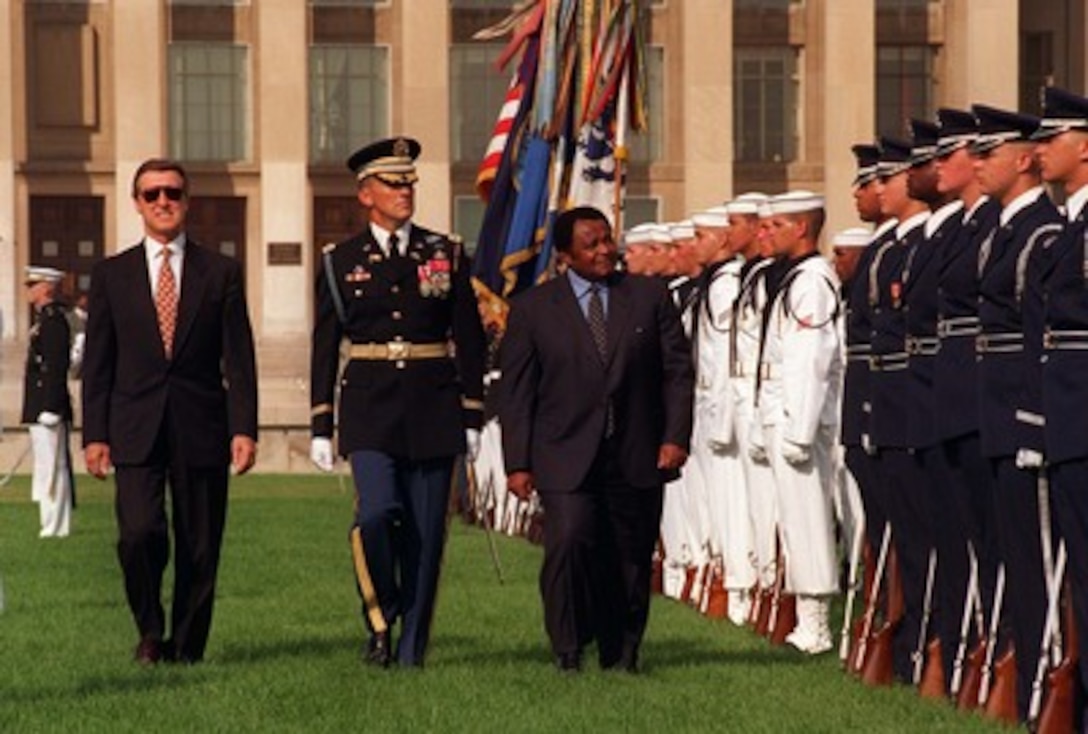 Minister of Defense Joe Modise of South Africa (right), inspects the joint services honor guard assembled at the Pentagon, July 28, 1997, to formally welcome him on his first official visit to the U.S. Department of Defense. Accompanying the Minister are Secretary of Defense William Cohen (left), his host for the visit, and the Commander of Troops for the ceremony, Col. Greg Gardner, U.S. Army, commander, 3rd U.S. Infantry (The Old Guard). Following the ceremony, the two defense leaders met to discuss a range of security issues of mutual interest to both nations. 