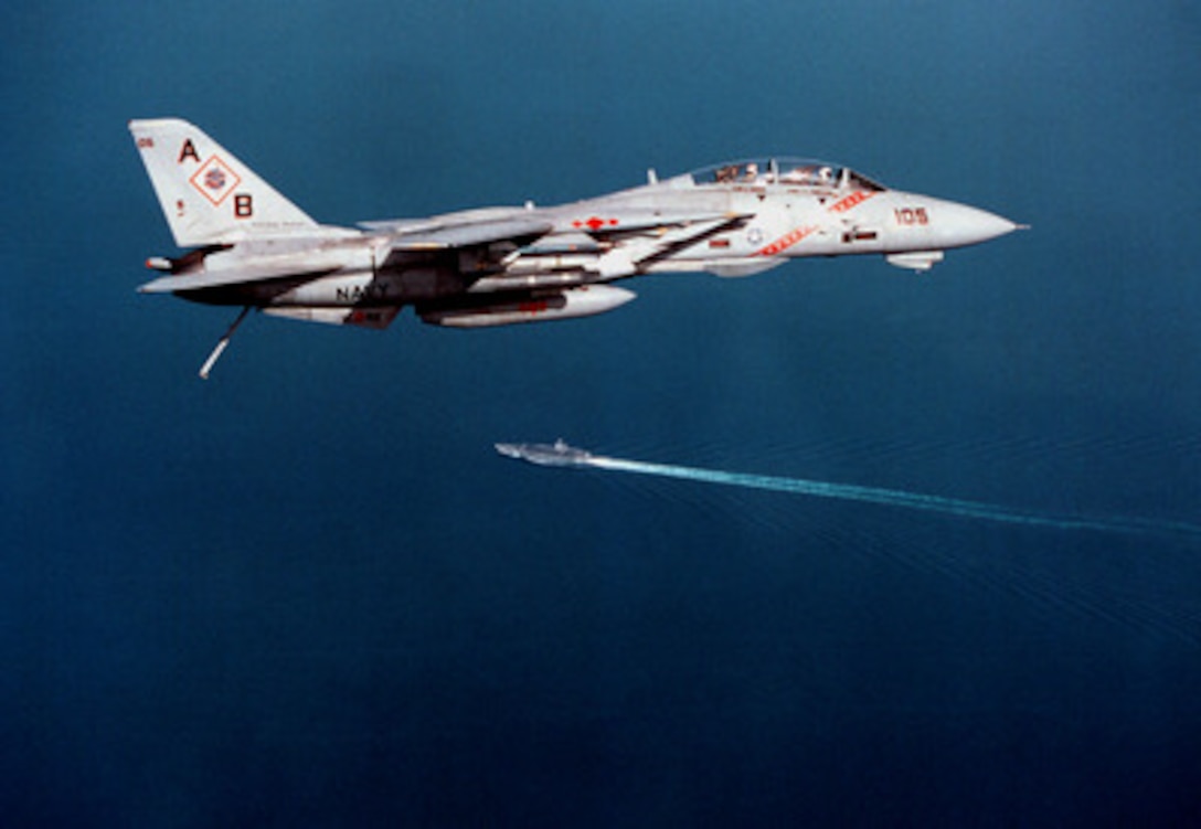 A U.S. Navy F-14B Tomcat prepares to make an arrested landing on board the aircraft carrier USS George Washington (CVN 73) as the ship conducts flight operations in the Persian Gulf on Nov. 24, 1997. Washington and her embarked Carrier Air Wing One are operating in the Persian Gulf in support of Operation Southern Watch which is the U.S. and coalition enforcement of the no-fly-zone over Southern Iraq. The Tomcat is assigned to Fighter Squadron 102 from Naval Air Station Oceana, Va. 