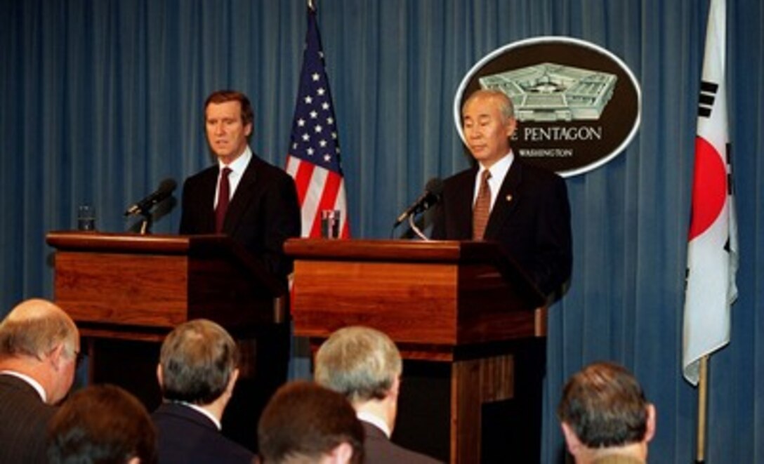Secretary of Defense William S. Cohen (left) and Minister of National Defense Kim Dong Jin (right), of the Republic of South Korea, conduct a joint Pentagon press briefing on Dec. 9, 1997. The briefing followed the 29th US-ROK Security Consultative Meeting in the Pentagon. 