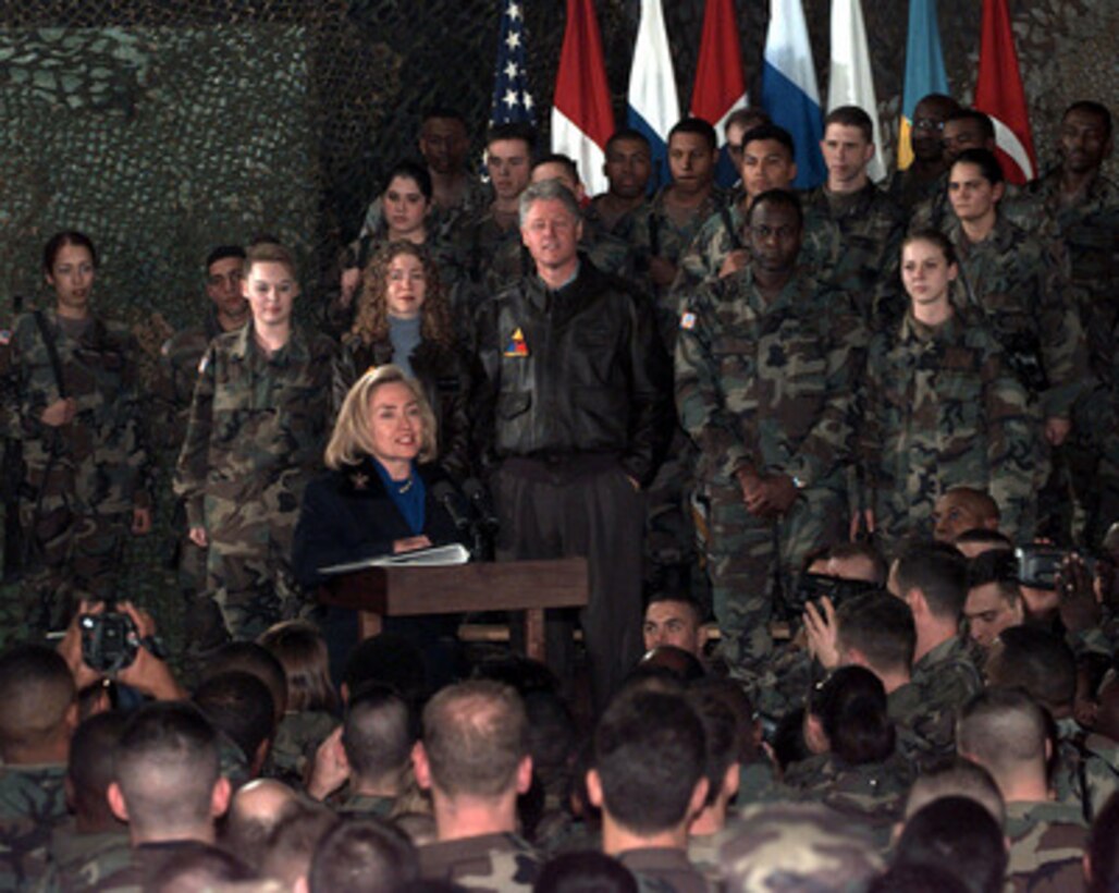First Lady Hillary Rodham Clinton talks to Task Force Eagle soldiers at the 21 Club, Eagle Base, Tuzla, Bosnia and Herzegovina, on Dec. 22, 1997. Mrs. Clinton, daughter Chelsea, former Senator Bob Dole and his wife Elizabeth, accompanied President Bill Clinton as he paid a holiday visit with the troops in Tuzla. 