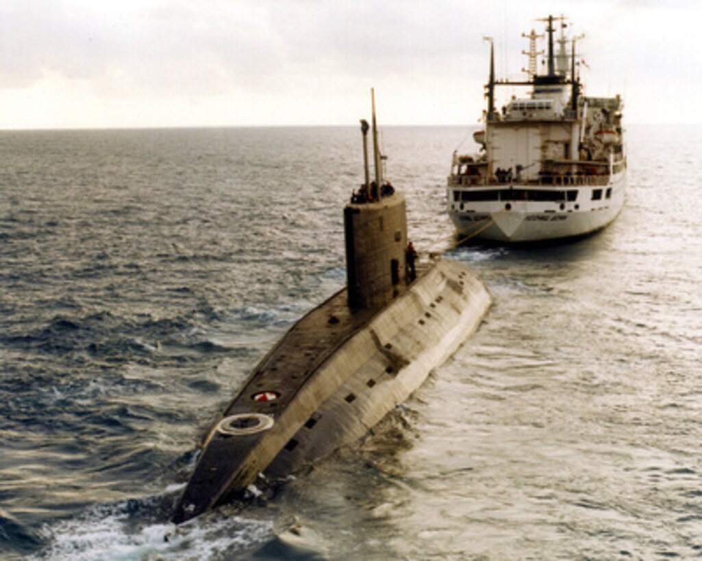 A Russian-built, Kilo-class diesel submarine recently purchased by Iran, is towed by a support vessel in this photograph taken in the central Mediterranean Sea during the week of December 23. The submarine and the support ship arrived at Port Said, Egypt, on Tuesday and were expected to begin transiting the Suez Canal today, Jan. 2, 1996. Ships and aircraft from the U.S. Navy's Sixth Fleet are tracking the submarine, which has been making the transit on the surface. This is the third Kilo-class submarine the Iranians have purchased from Moscow. 