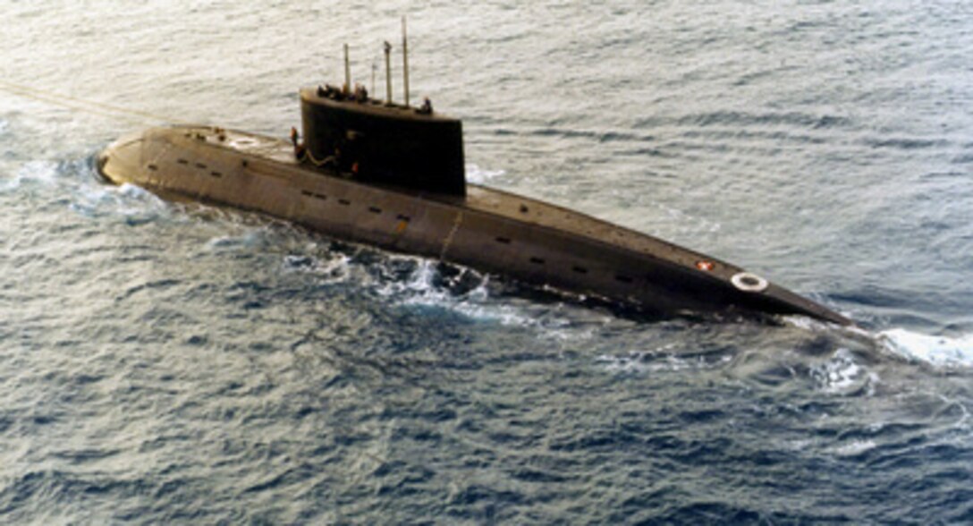A Russian-built, Kilo-class diesel submarine recently purchased by Iran, is towed by a support vessel in this photograph taken in the central Mediterranean Sea during the week of December 23. The submarine and the support ship arrived at Port Said, Egypt, on Tuesday and were expected to begin transiting the Suez Canal today, Jan. 2, 1996. Ships and aircraft from the U.S. Navy's Sixth Fleet are tracking the submarine, which has been making the transit on the surface. This is the third Kilo-class submarine the Iranians have purchased from Moscow. 