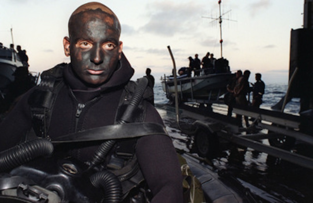 Royal Australian Navy Able Seaman Uri Kurop, Clearance Diving Team 1, prepares for a night dive with the rest of his team during Exercise Kernel Blitz 97, on June 20, 1997. Explosive ordnance disposal and mine clearing teams from the U.S., Australia and Canada are taking part in the exercise to ensure mine free sea lanes. Kernel Blitz 97 is a major amphibious exercise taking place in Southern California and waters offshore. More than 12,000 sailors, Marines, soldiers, guardsmen and airmen are involved in the exercise which is designed to test the Navy-Marine Corps team's ability to project combat power ashore. Kurop's team is operating from the USS Denver (LPD 9). 