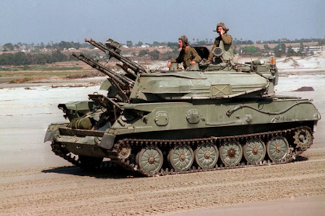 Marines from the 1st Marine Division, 3rd Amphibious Armored Vehicle Battalion add realism to Exercise Kernel Blitz 97 by driving former Soviet bloc armored vehicles at Camp Pendleton, Calif., on June 21, 1997. Kernel Blitz 97 is a major amphibious exercise taking place in Southern California and waters offshore. More than 12,000 sailors, Marines, soldiers, guardsmen and airmen are involved in the exercise which is designed to test the Navy-Marine Corps team's ability to project combat power ashore. These Marines are acting as the opposing force, commonly called the OPFOR. 