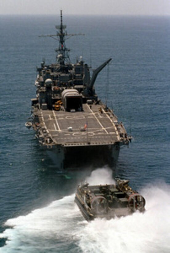 A U.S. Navy Landing Craft Air Cushion lines up to enter the well deck of the USS Denver (LPD 9) off the coast of Camp Pendleton, Calif., on June 24, 1997. The landing craft, or LCAC as it more commonly called, is delivering troops and cargo to the USS Denver during Exercise Kernel Blitz 97. Kernel Blitz 97 is a major amphibious exercise taking place in Southern California and waters offshore. More than 12,000 sailors, Marines, soldiers, guardsmen and airmen are involved in the exercise which is designed to test the Navy-Marine Corps team's ability to project combat power ashore. The LCAC is from Assault Craft Unit 5, Camp Pendleton, Calif. 