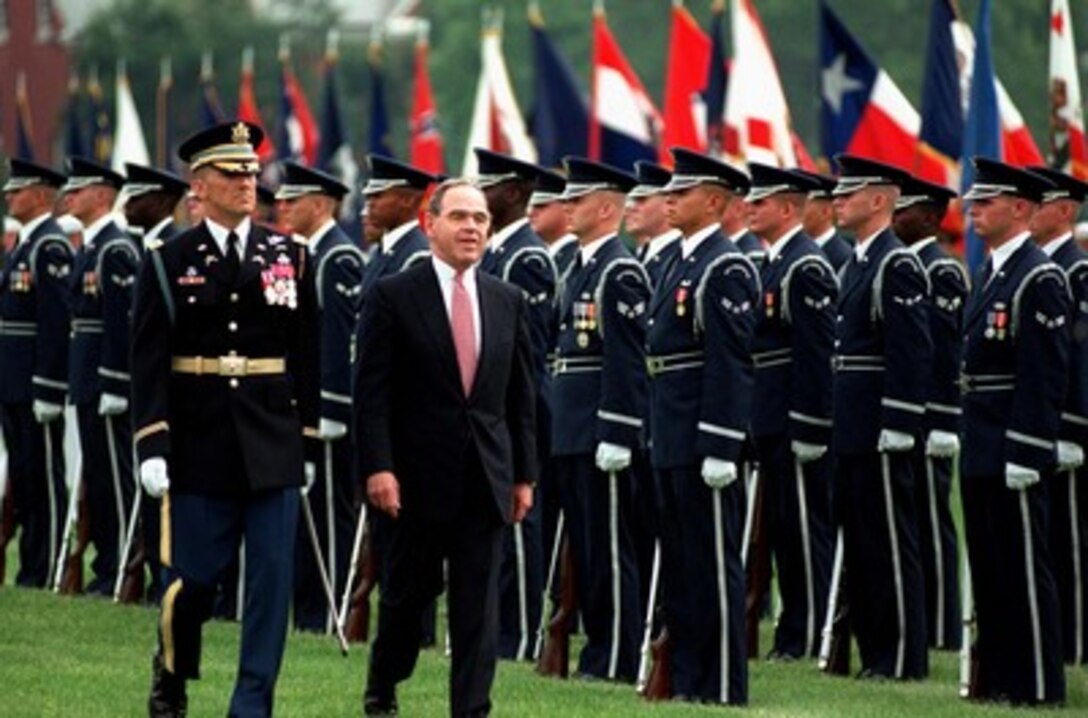 Col. Gregory C. Gardner (left) U.S. Army, escorts Deputy Secretary of Defense John P. White (right), as he inspects the troops during his Armed Forces Full Honor Review and Award ceremony at Fort Myer, Va., on June 30, 1997. The farewell ceremony is being hosted by Secretary of Defense William S. Cohen and Gen. John M. Shalikashvili, U.S. Army, chairman of the Joint Chiefs of Staff. Gardner is the Commander of the 3rd U.S. Infantry (The Old Guard). 