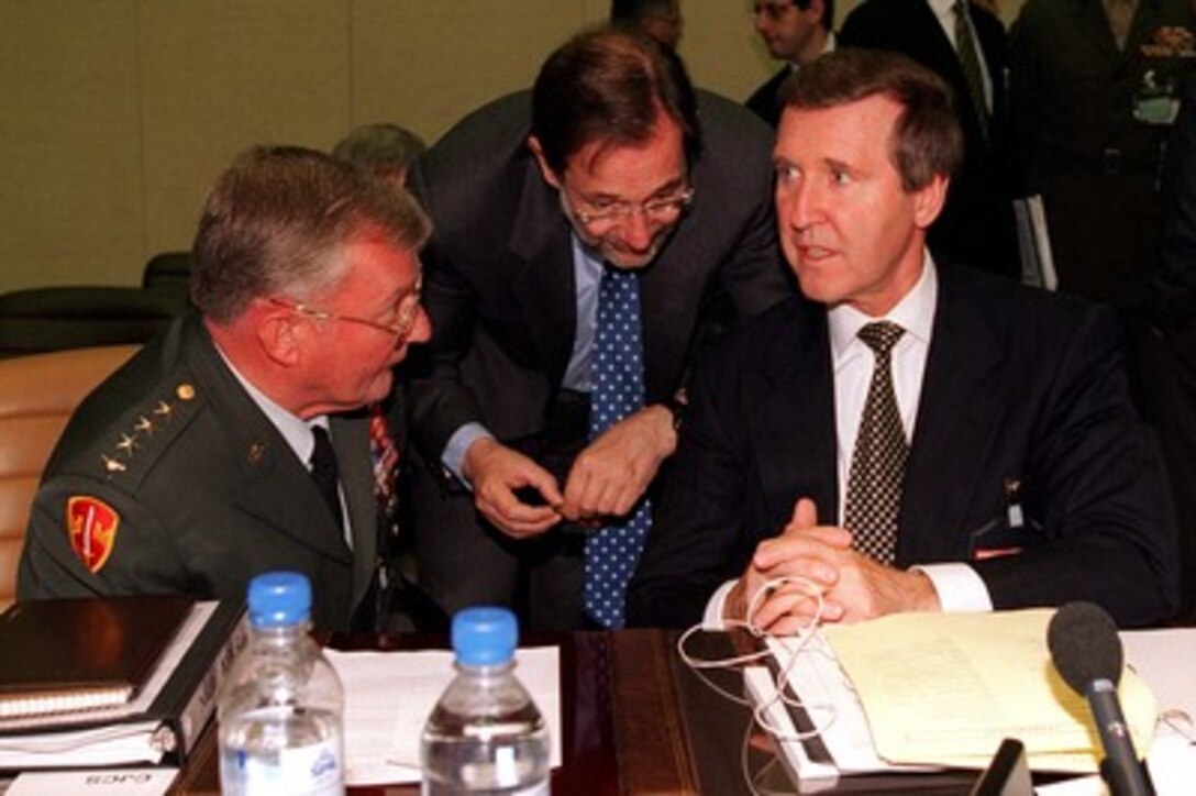 NATO Secretary General Javier Solana (center) confers with Secretary of Defense William S. Cohen (right) and Chairman of the Joint Chiefs of Staff Gen. John M. Shalikashvili (left), U.S. Army, prior to the NATO Defense Planning Committee meeting in Brussels, Belgium, on June 12, 1997. 