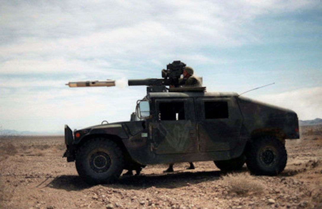 A Tube Launched, Optically Tracked, Wire-guided (TOW) missile hurtles out of its launcher mounted on a U.S. Marine Corps Humvee at the Marine Corps Air Ground Combat Center, Twentynine Palms, Calif., during Combined Arms Exercise 5-97, on April 20, 1997. The Marine Air Ground Task Force exercise is allowing these Marines of the TOW platoon, Weapons Company, 3rd Battalion, 2nd Marine Regiment, to practice their desert warfare at the Twentynine Palms Lead Mountain Range. 