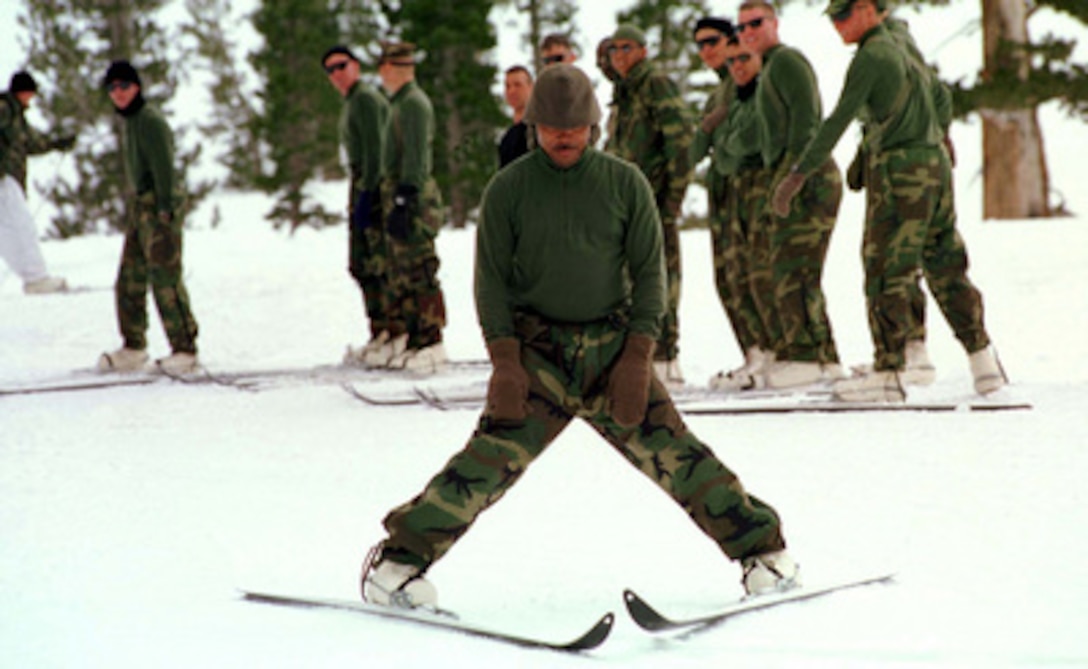 One Kilo Company Marine practices his wedge stop as his fellow Marines wait their turn on the ski slopes of Silver Creek, Calif., on Feb. 3, 1997. Marines from the 2nd Marine Regiment and 3rd Battalion, 8th Marines of Camp Lejeune, N. C., are at the at the Mountain Warfare Training Center, Bridgeport, Calif., to train in cold weather survival and arctic warfare. 