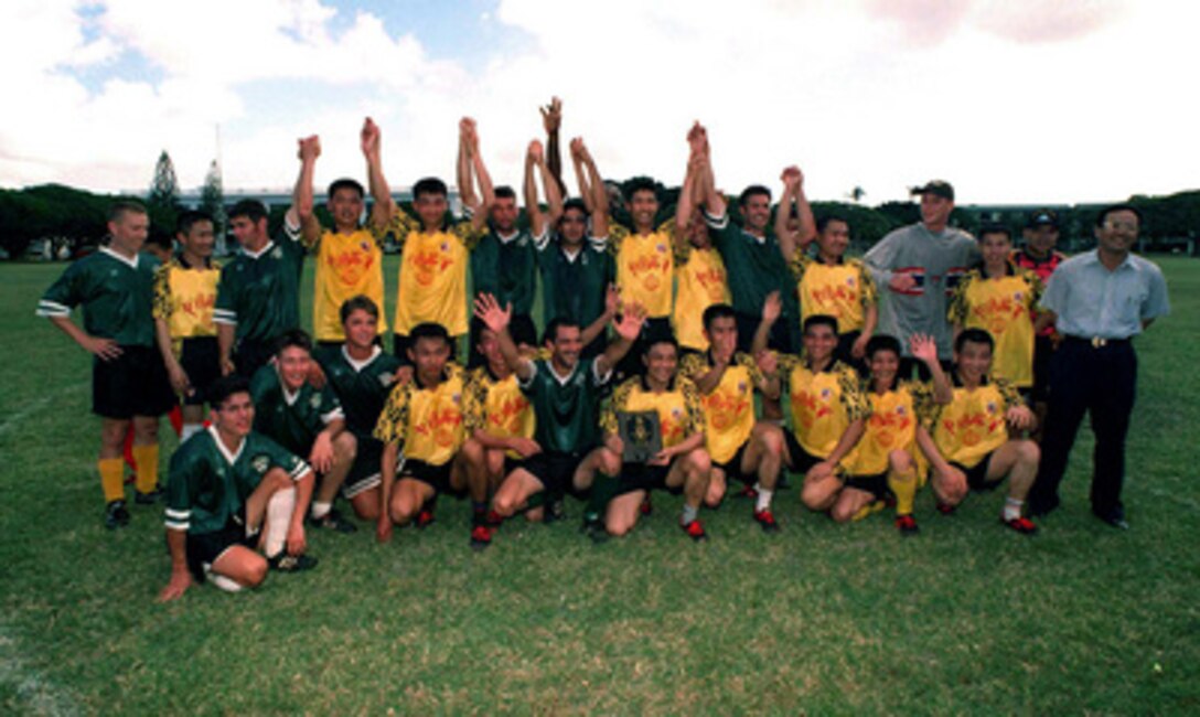 Sailors from U.S. Navy and People's Republic of China Navy soccer teams celebrate a game well played after a match that ended in a tie at Naval Station Pearl Harbor, Hawaii, on March 9, 1997. Three People's Republic of China ships are visiting Hawaii for the first part of a scheduled goodwill visit between the U.S. and Chinese navies. The ships will continue on to San Diego, Calif., for a first-ever visit by People's Republic of China Navy ships to the mainland U.S. The U.S. and the People's Republic of China navies are the two largest fleets in the Asia-Pacific region. Interaction between the two navies increases mutual understanding and confidence. During the visits, Chinese sailors will have the opportunity to meet their U.S. Navy counterparts, tour U.S. ships, experience American culture in Hawaii and Southern California, and learn about the United States. 