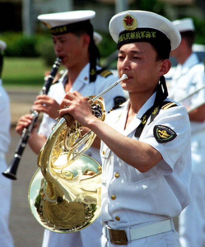 Sailors from the People's Republic of China Navy Band perform at Naval Station Pearl Harbor, Hawaii, on March 11, 1997. Three People's Republic of China ships are visiting Hawaii for the first part of a scheduled goodwill visit between the U.S. and Chinese navies. The ships will continue on to San Diego, Calif., for a first-ever visit by People's Republic of China Navy ships to the mainland U.S. The U.S. and the People's Republic of China navies are the two largest fleets in the Asia-Pacific region. Interaction between the two navies increases mutual understanding and confidence. During the visits, Chinese sailors will have the opportunity to meet their U.S. Navy counterparts, tour U.S. ships, experience American culture in Hawaii and Southern California, and learn about the United States. 