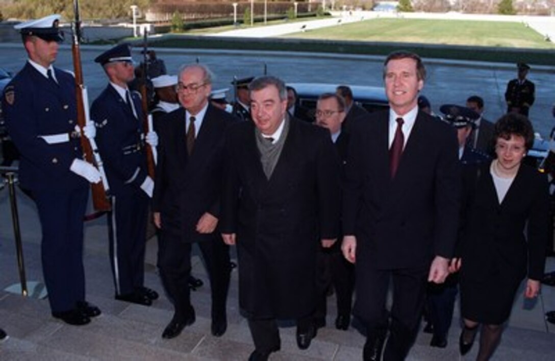 Secretary of Defense William S. Cohen (right) escorts visiting Russian Foreign Minister Yevgeny Primakov (center) into the Pentagon, March 16, 1997, where the two men met to discuss a variety of issues of mutual interest to both nations. 
