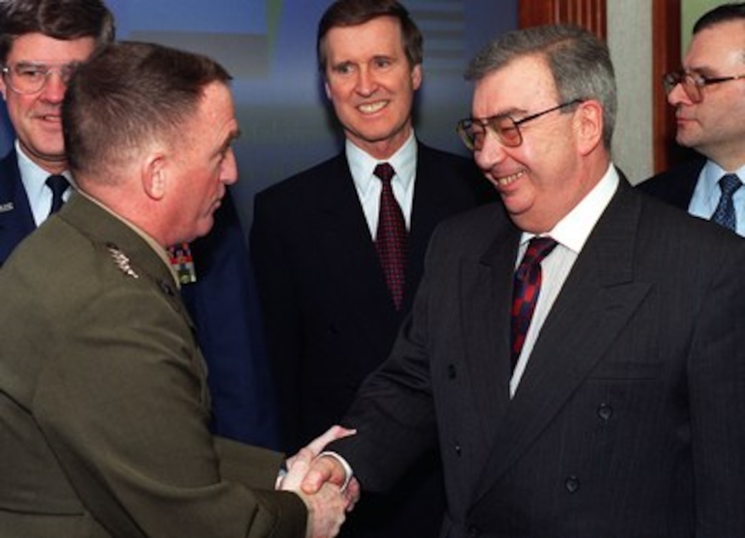 Gen. Charles Krulak, commandant, U.S. Marine Corps (left) greets visiting Russian Foreign Minister Yevgeny Primakov (right) as he enters the Pentagon conference room of the Joint Chiefs of Staff which is more commonly known as the "tank". Primakov and Secretary of Defense William S. Cohen (center) met with the Joint Chiefs to discuss a variety of security issues including NATO expansion and strategic arms reduction. 