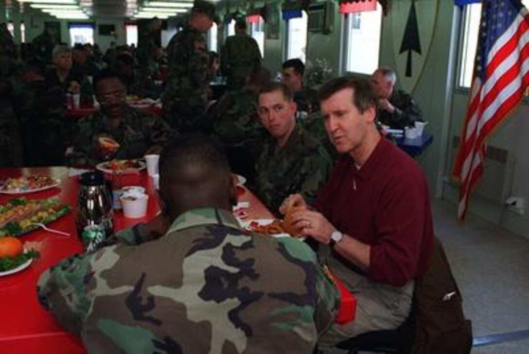 Secretary of Defense William S. Cohen has lunch with the troops on March 6, 1997, at the Task Force Eagle dining facility, Camp Dobol, Bosnia and Herzegovina. Cohen met with U.S. and Russian troops based there. 