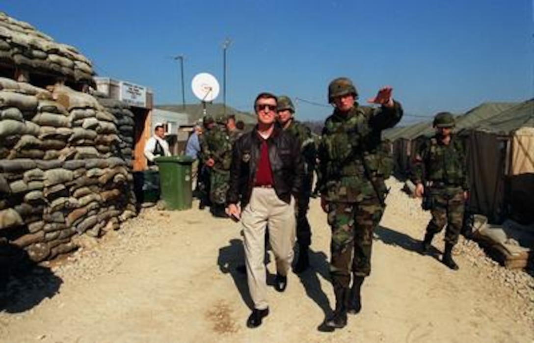 Lt. Col. Robin Swan (right), U.S. Army, commander, Task Force 1-26 Infantry, gives a base camp tour to Secretary of Defense William S. Cohen (left) on March 6, 1997. This is Cohen's first visit to NATO's stabilization force operation since taking office in January. 