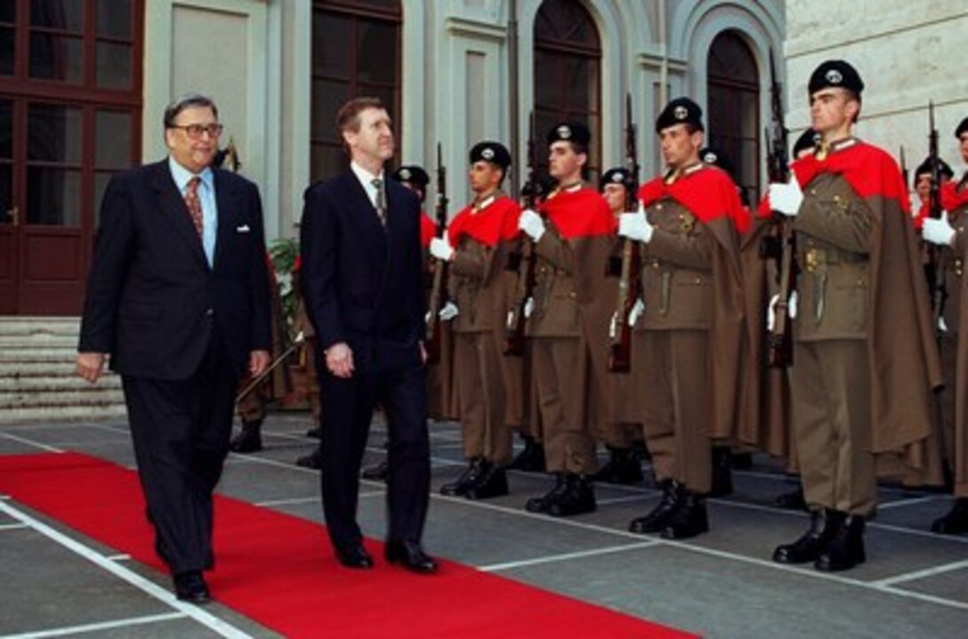 Italian Minister of Defense Beniamino Andreatta (left) escorts Secretary of Defense William S. Cohen (right) during an armed forces honor ceremony. Cohen was welcomed to Army Headquarters, Rome, Italy, on March 7, 1997. 