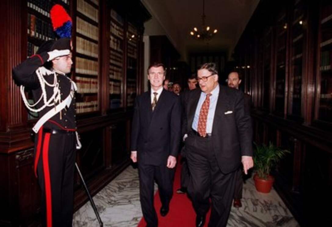 Secretary of Defense William S. Cohen (left) and Italian Minister of Defense Beniamino Andreatta (right) walk to the Defense Ministry library. Cohen and Andreatta conducted a joint press conference in Rome on March 7, 1997. 
