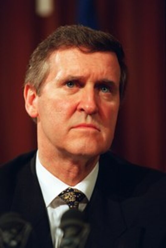 Secretary of Defense William S. Cohen listens to a reporter's question during a press briefing at NATO Headquarters on March 7, 1997. Cohen traveled to Brussels to conduct a roundtable discussion with NATO Permanent Representatives. 