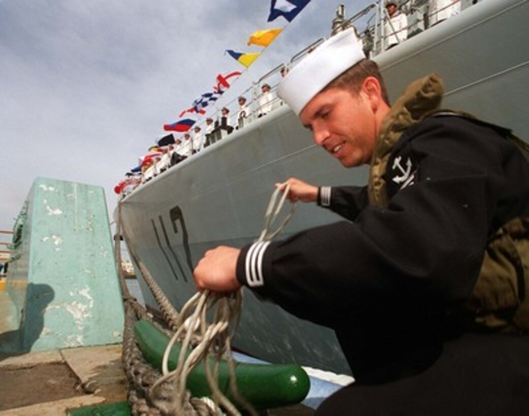 Seaman Ricardo Ponche untangles a heaving line as the People's Republic of China destroyer Harbin (DD 112) is moored in San Diego, Calif., on March 21, 1997, for a first-ever visit by People's Republic of China Navy ships to the mainland U.S. Harbin and two other People's Republic of China ships are visiting Southern California for the second part of a goodwill visit between the U.S. and Chinese navies. The ships visited Hawaii on their way to San Diego. The U.S. and the People's Republic of China navies are the two largest fleets in the Asia-Pacific region. Interaction between the two navies increases mutual understanding and confidence. During the visit Chinese sailors will have the opportunity to meet their U.S. Navy counterparts, tour U.S. ships and experience American culture in Southern California. The destroyers Harbin and Zhuhai, and supply ship Nancang will moor next to the U. S. Navy's aircraft carrier USS Constellation (CV 64), at Naval Air Station North Island. 