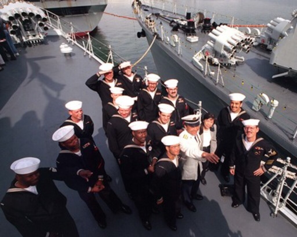 American sailors tour the decks of the People's Republic of China destroyer Harbin (DDG 112) while the ship is moored at Naval Air Station North Island, San Diego, on March 22, 1997, for a first-ever visit by People's Republic of China Navy ships to the mainland U.S. Harbin and two other People's Republic of China ships are visiting Southern California for the second part of a goodwill visit between the U.S. and Chinese navies. The ships visited Hawaii on their way to San Diego. The U.S. and the People's Republic of China navies are the two largest fleets in the Asia-Pacific region. Interaction between the two navies increases mutual understanding and confidence. During the visit Chinese sailors will have the opportunity to meet their U.S. Navy counterparts, tour U.S. ships and experience American culture in Southern California. 