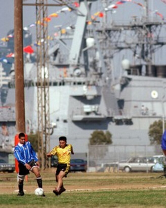 A People's Republic of China sailor and a U.S. Navy sailor square off during a friendly game of soccer at Naval Air Station North Island in San Diego, Calif., on March 22, 1997. Three People's Republic of China Navy ships are in San Diego for a first-ever visit to the mainland U.S. as the second part of a goodwill visit between the U.S. and Chinese navies. The ships visited Hawaii on their way to San Diego. The U.S. and the People's Republic of China navies are the two largest fleets in the Asia-Pacific region. Interaction between the two navies increases mutual understanding and confidence. During the visit Chinese sailors will have the opportunity to meet their U.S. Navy counterparts, tour U.S. ships and experience American culture in Southern California. 