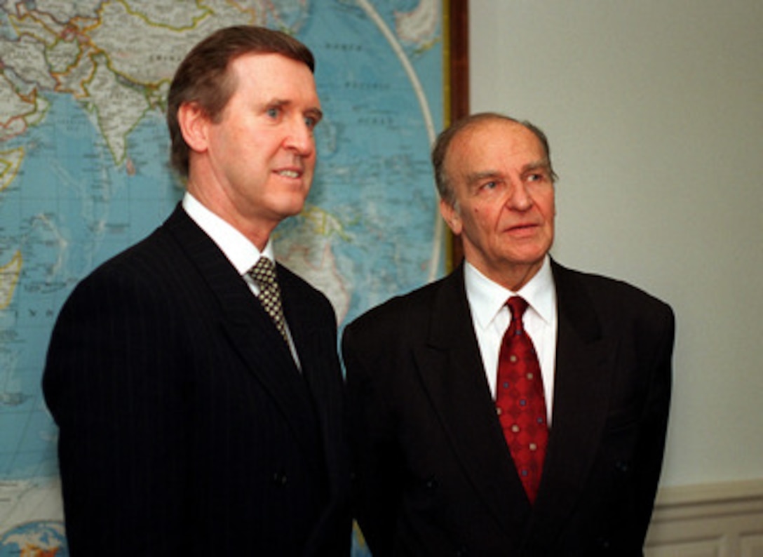 Secretary of Defense William S. Cohen (left), and President Alija Izetbegovic (right), of the Republic of Bosnia and Herzegovina, listen to a reporter's question during a media availability in the secretary's office on March 24, 1997. The media availability followed an Armed Forces Honor Cordon welcoming Izetbegovic to the Pentagon. 