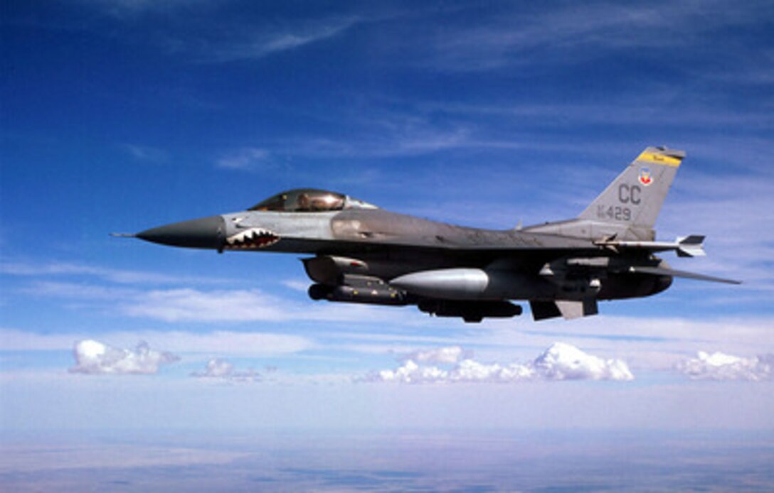 A U.S. Air Force F-16 Fighting Falcon returns from a bombing mission over the New Mexico desert as part of Exercise Roving Sands '97 on April 21, 1997. More than 20,000 service members from all branches of the armed forces of the U.S., Canada, Germany, and the Netherlands are participating in Exercise Roving Sands 97. The exercise is designed to refine their skills in operations using an integrated air defense network of ground, missile and radar early warning systems combined with tactical fighter and bomber aircraft operating in a simulated high-threat environment. The Fighting Falcon is operating out of the 524th Fighter Squadron, Cannon Air Force Base, N.M. 