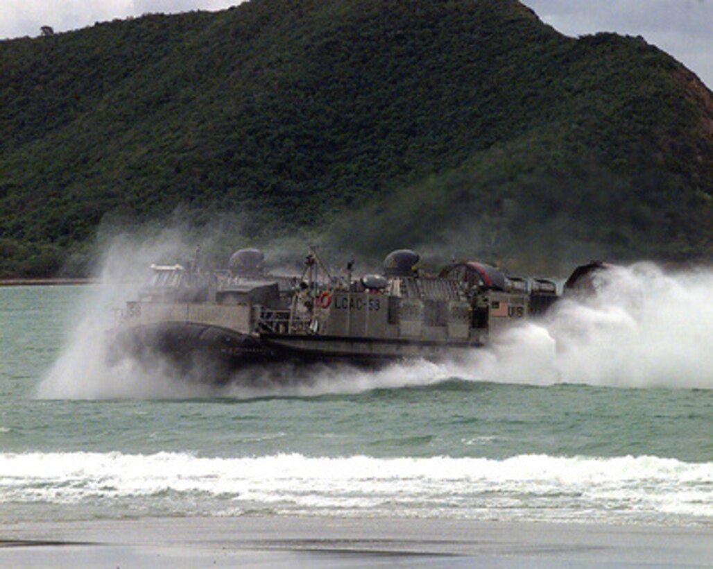 A U.S. Navy Landing Craft Air Cushion heads for the beach near Hat Yai, Thailand, during an amphibious assault on May 20, 1997. The Landing Craft Air Cushion, or LCAC as it is more commonly known, is carrying a cargo of vehicles and troops from offshore ships as part of Exercise Cobra Gold '97. Cobra Gold '97 is the latest in a continuing series of U.S. /Thai military exercises designed to ensure regional peace and strengthen the ability of the Royal Thai Armed Forces to defend Thailand. The training includes joint combined air, land and sea operations. Cobra Gold is the largest strategic mobility exercise involving the U.S. Pacific Command forces this year. 