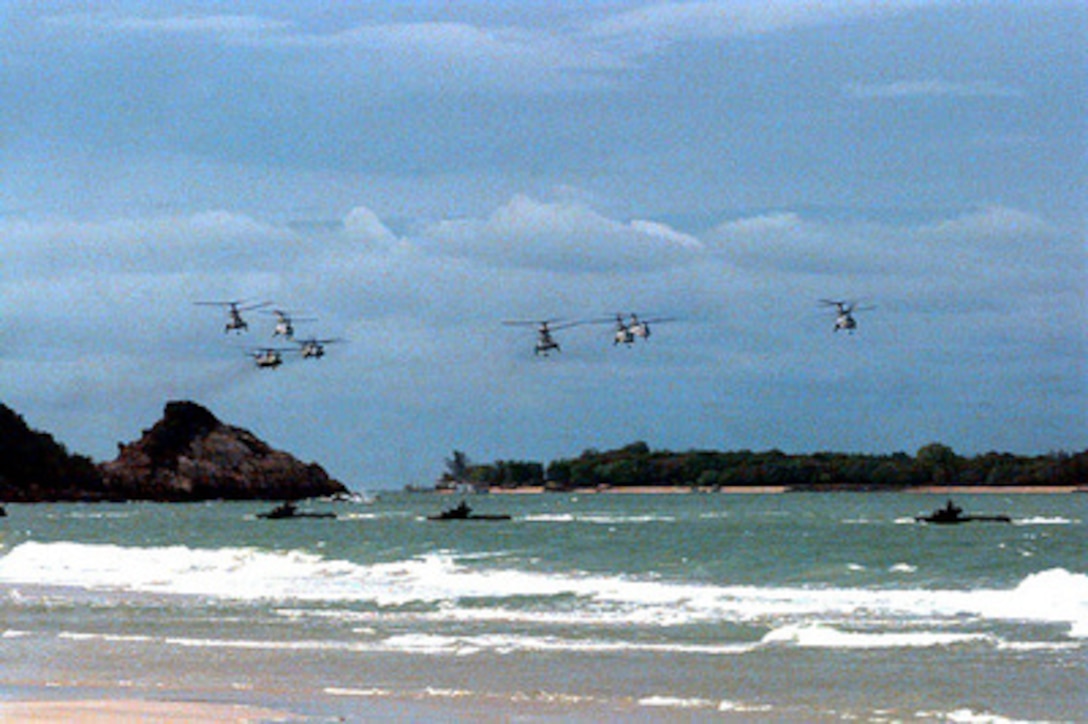 CH-46 Sea Knight and CH-53 Super Stallion helicopters combine with amphibious landing craft to attack from the sea during an air and amphibious assault on the beach near Hat Yai, Thailand, on May 20, 1997. The helicopters and landing craft are bringing U.S. and Royal Thai troops ashore as part of Exercise Cobra Gold '97. Cobra Gold '97 is the latest in a continuing series of U.S. /Thai military exercises designed to ensure regional peace and strengthen the ability of the Royal Thai Armed Forces to defend Thailand. The training will include joint combined air, land and sea operations. Cobra Gold is the largest strategic mobility exercise involving the U.S. Pacific Command forces this year. 