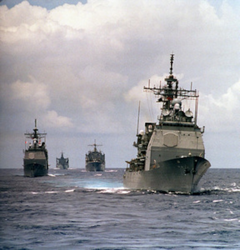 The USS Lake Erie (CG 70) (right), USS Mount Hood (AE 29) (center), USS Cimarron (AO 177) (left) and USS Chosin (CG 65) (far left), conduct operations in the Pacific Ocean on April 14, 1997. The ships are part of the aircraft carrier USS Constellation battle group en route to the Persian Gulf to enforce no-fly zones and monitor shipping to and from the region. 