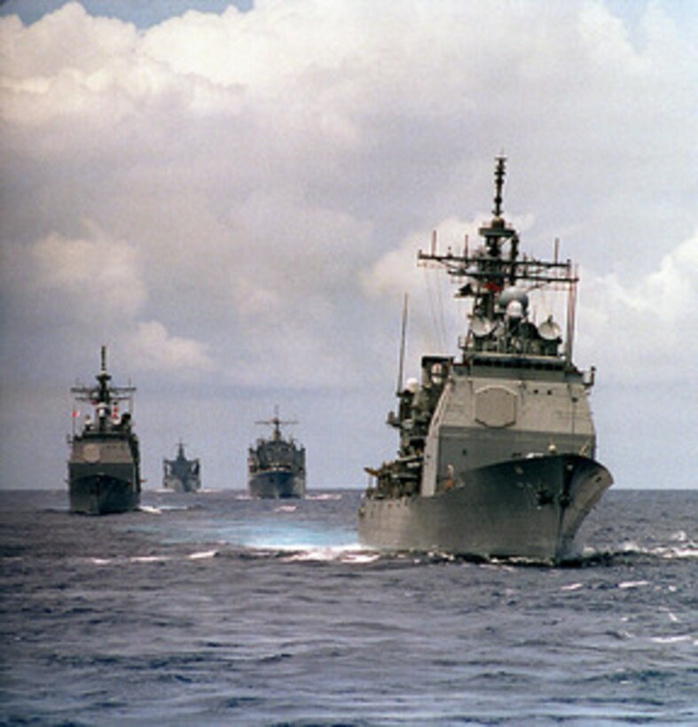 The USS Lake Erie (CG 70) (right), USS Mount Hood (AE 29) (center), USS Cimarron (AO 177) (left) and USS Chosin (CG 65) (far left), conduct operations in the Pacific Ocean on April 14, 1997. The ships are part of the aircraft carrier USS Constellation battle group en route to the Persian Gulf to enforce no-fly zones and monitor shipping to and from the region. 